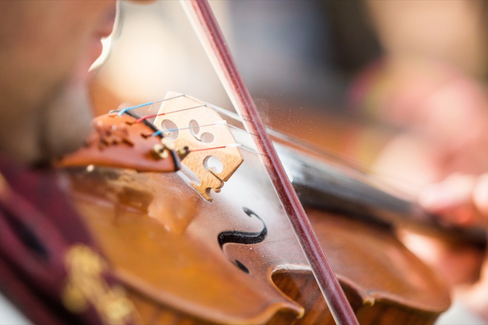 A violin being played in an orchestra